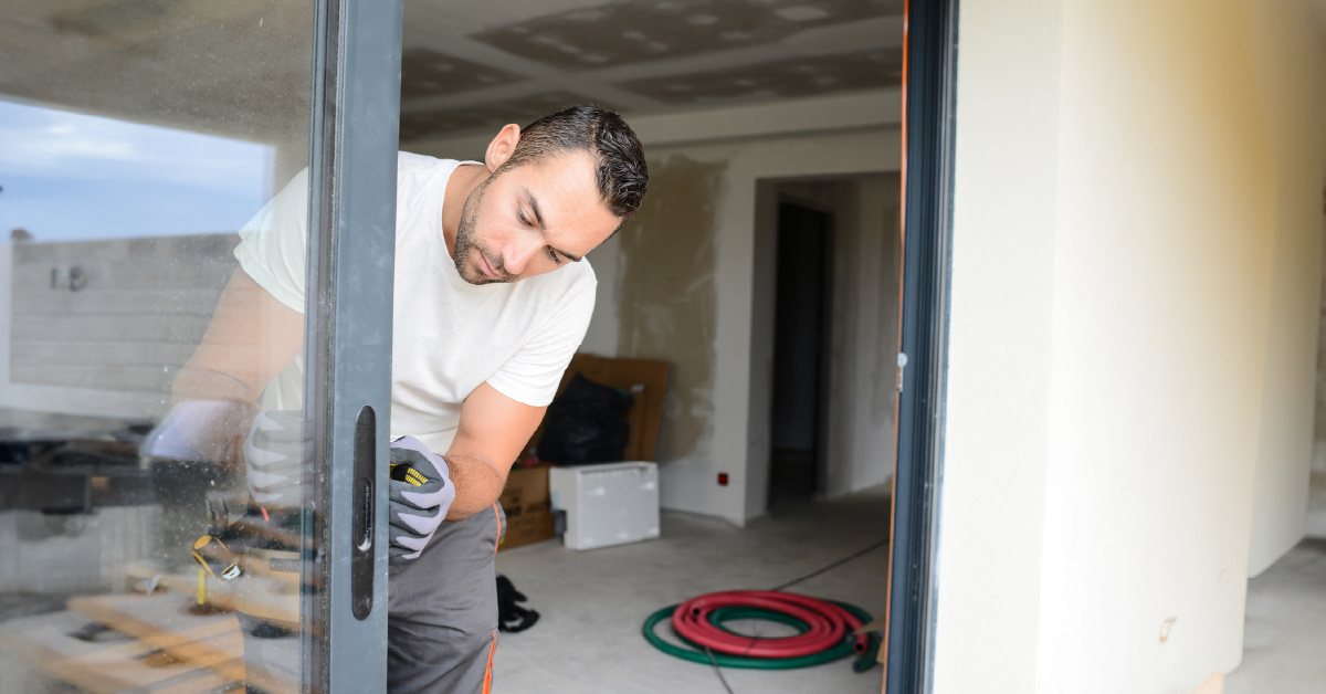 Man Installing Glass Door